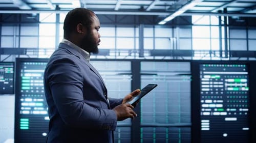 Man Using Tablet in Modern Data Center