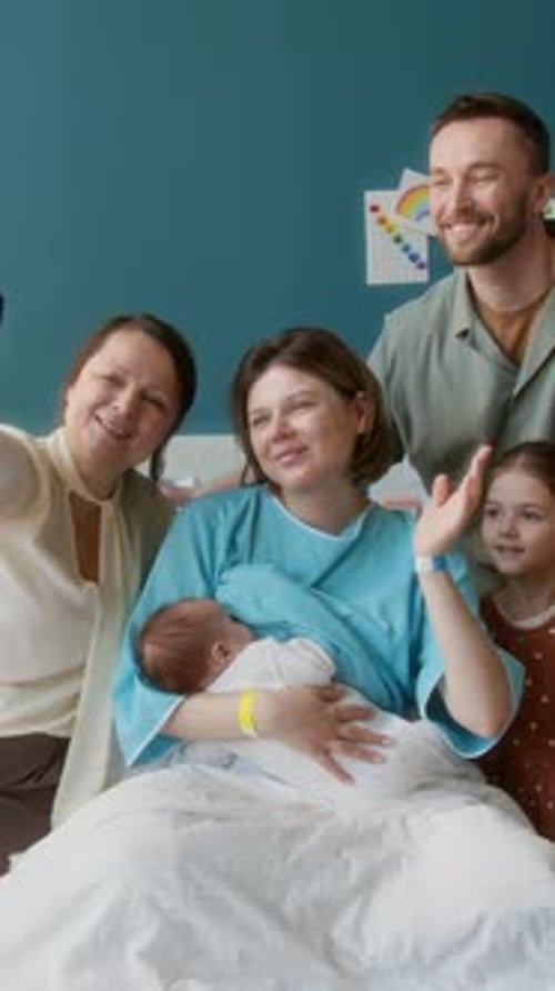 Family Posing For Selfie in Maternity Hospital
