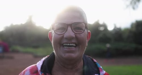 Senior Woman Smiling On Camera After Sport Workout At City Park - Healthy Lifestyle And Sport