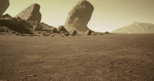 Rocky Landscape with Distant Hills Under a Dusty Sky at Twilight