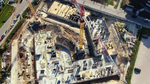 High building construction site. Big industrial tower crane with blue sky amd cityscape on backgroun