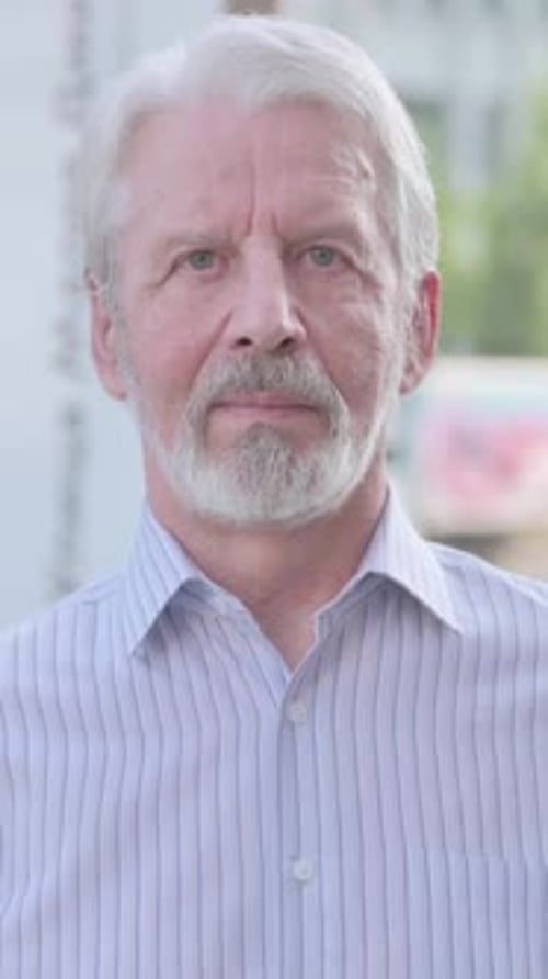 Senior Man Portrait Looking Directly At The Camera