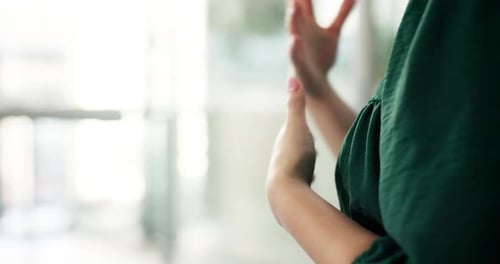Hands Clapping in Office Setting