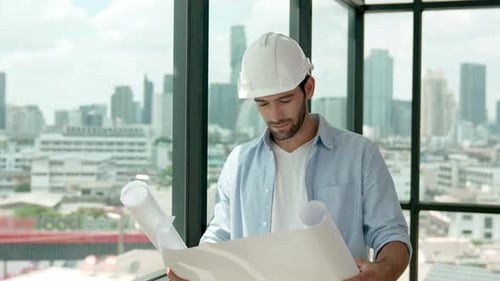 Professional engineer smiling while looking at skyscraper view. Tracery