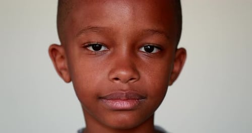 Serious African little boy portrait looking at camera