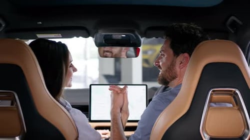 Back View Caucasian Couple Family Woman Man Inside Car Holding Hands Smiling Girl Female Guy Male