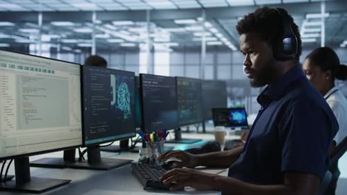 Engineer in Data Center Wearing Headphones Implementing AI Systems