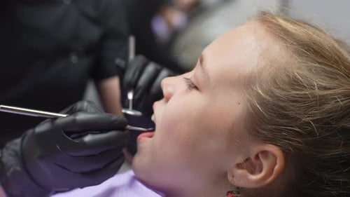 Child Having Dental Exam at Dentist Office