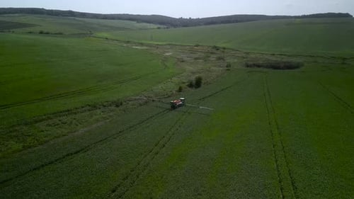 Spray Fertilize On Field With Chemicals In Agriculture Field