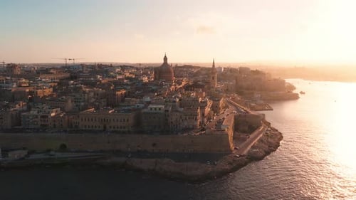 Aerial Sunset Sweep of Valletta Malta with Dome and Spire