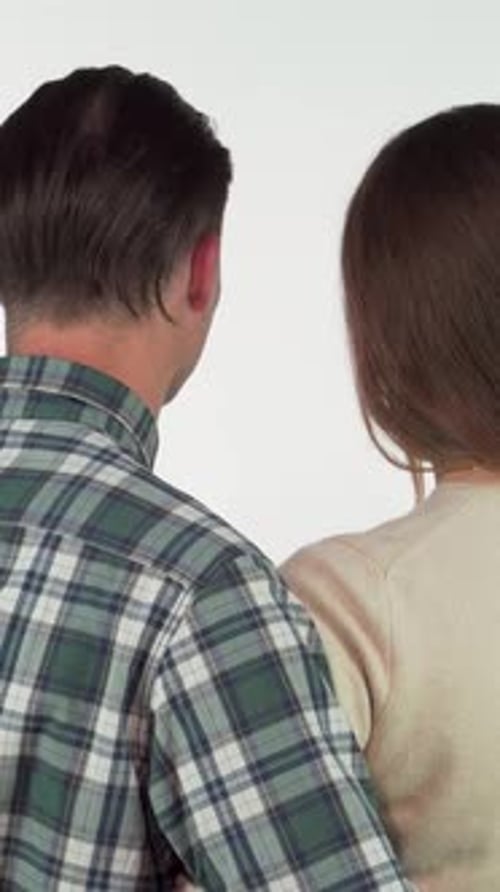 Smiling Young Couple Embracing Portrait on White Background