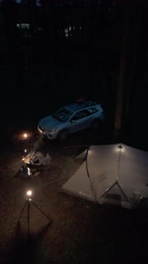 Aerial view, camping alone in the pine forest with SUV car