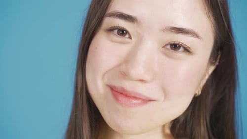 Close-up portrait of beautiful asian young woman with happy and smooth face.