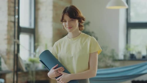Portrait of Joyous Girl in Yoga Studio