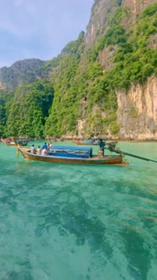 Longtail Boats and Green Blue Turqouse Lagoon at Pileh Lagoon Tropical Island Koh Phi Phi Thailand