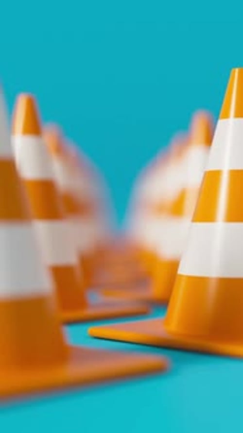 Front View Grid of Traffic Cones in Orange on a Blue Background for Road Safety and Construction