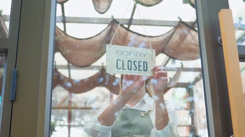 Store Owner Opening Shop Turning Sign on Door