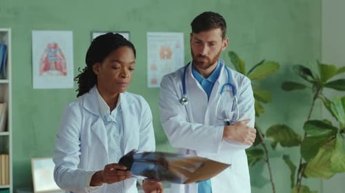 Professional Team of Multiethnic Doctors Cooperating in Medic Healthcare Clinic Male and Female