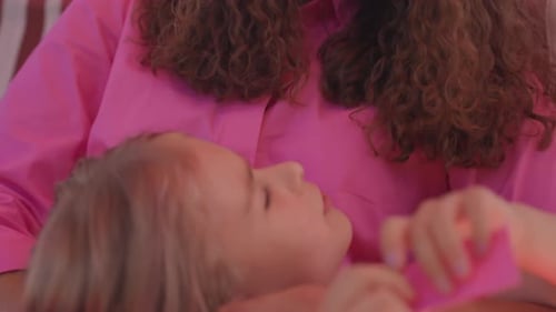 Child Resting With Adult in a Home