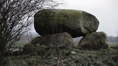 Beautiful old ancient stone megalithic burial monument site in Germany, arc shot