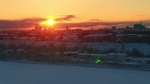 Sunrise Over Snow Covered City Frozen River Aerial