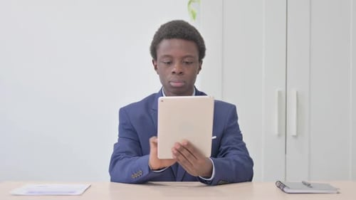 Man Uses Tablet in Bright Workplace Office