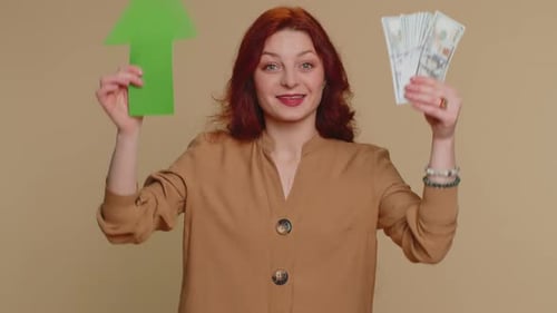Woman Holding Arrow and Money Showing Financial Success