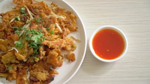 Crispy fried mussel pancake with egg - Thai street food style