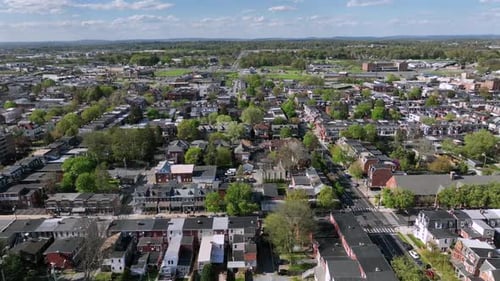 Beautiful Aerial View Of A Sunlit Suburban Town With Greenery