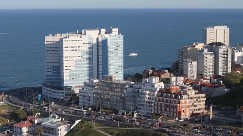 Aerial view of Mar del Plata waterfront with buildings and sea in background. Argentina