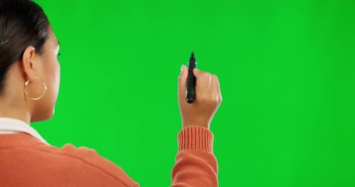 Woman, writing and pen on green screen or mockup for presentation against a studio background