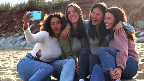 Four Friends Taking a Selfie on Beach