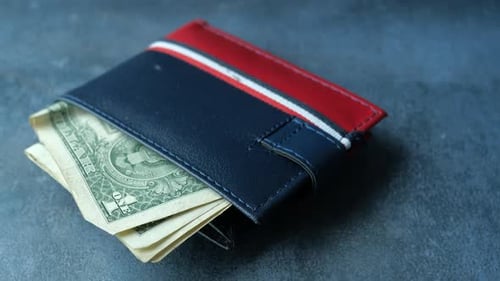 Close Up of Cash in Wallet on Table