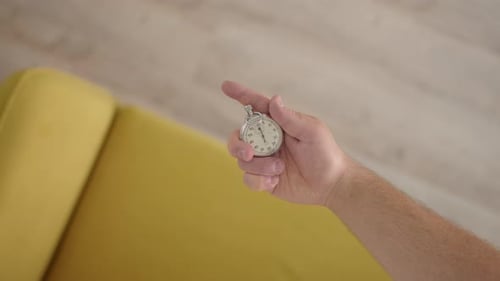 Top Down View Unrecognizable Man His Hand with Chronometer in His Hand and Marks Time Stopwatch