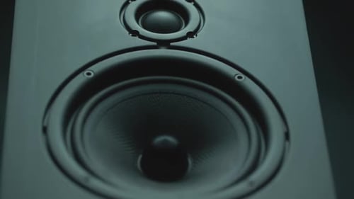 Zooming Close up of a Black Speaker