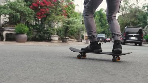 Man Balancing with Two Legs on Skateboard