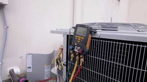 HVAC System With Diagnostic Meter and Colorful Hoses