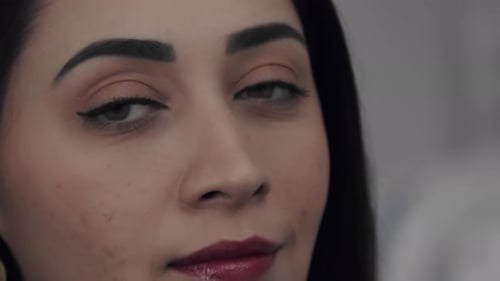 Beautiful Woman with Makeup Close-Up Smiling