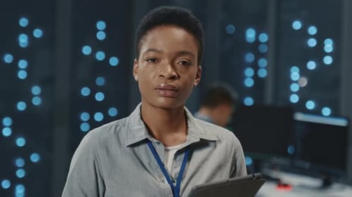 Woman Working with Tablet in Modern Data Center