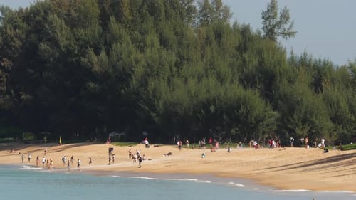 People on Mai Khao Beach Near the Runway