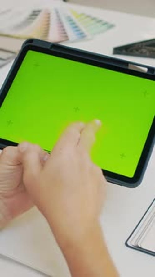 Man Holding Digital Tablet with Chroma Key Screen