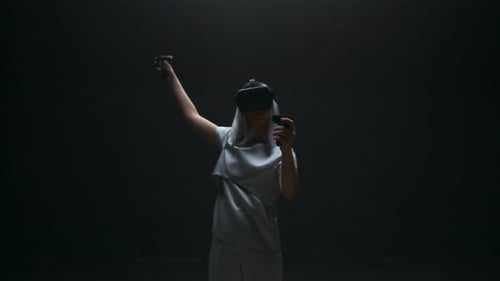 Woman Using VR Headset in Dark Room
