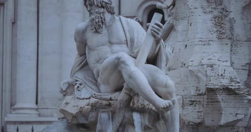 Zoom in closeup clip of a the representation of the Nile. Detail of Fountain of the Four Rivers in N