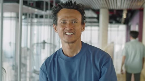 Portrait of Joyous Asian Man during Day in Office Center