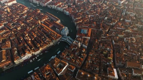 Venice And Its Grand Canal At Sunrise In Italy - aerial drone shot