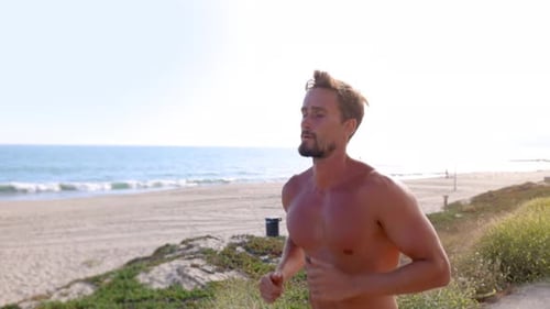Athletic Man Exercising At The Beach