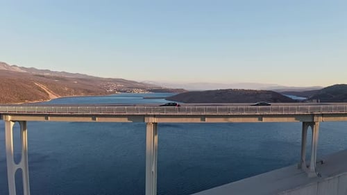 Drone shot of the bridge and ocean in the sunset 6