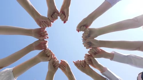 Young Group People Background Making a Circle Against a Blue Sky Teamwork Concept