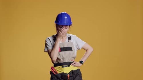 Portrait of Tired Drained Handywoman Yawning After Building Work