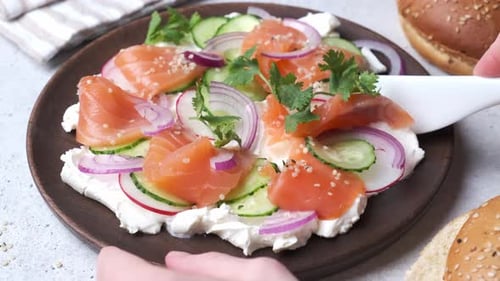 Smoked Salmon Sandwich Preparation with Fresh Ingredients